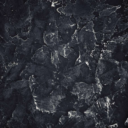 Black plaster texture. Black stucco background. Copy space for text. flat lay.の写真素材