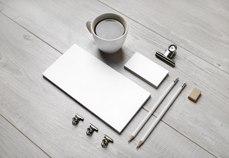 Blank stationery set on light wooden background. ID template. Mockup for branding identity for designers.の写真素材