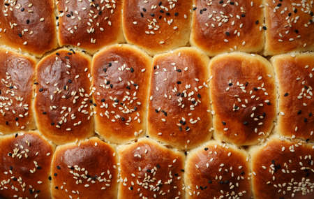 Fresh delicious sweet buns with sesame seeds. flat lay.の写真素材