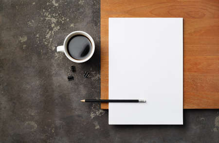 Blank stationery: letterhead, pencil and coffee cup. Blank objects for placing your design. Copy space for text. flat lay.の写真素材
