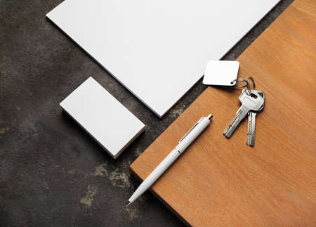 Blank corporate stationery set, keys and wooden board. Mockup for branding identity for designers.の写真素材