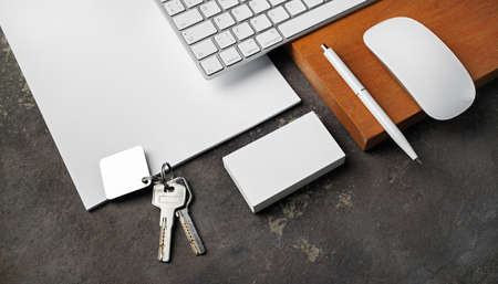 Blank stationery, keys and gadgets. real estate agency concept.の写真素材
