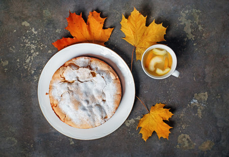 Apple pie, compote and autumn maple leaves. flat lay.の写真素材