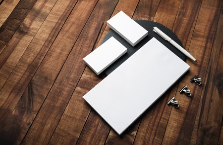 Blank branding stationery set on wooden background. Responsive design template.の写真素材