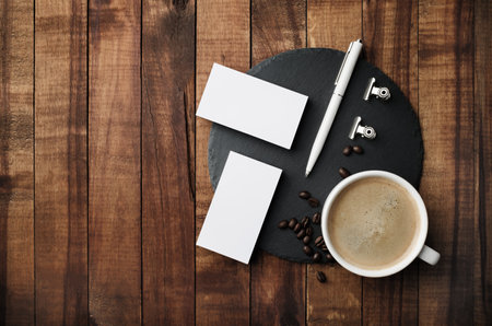 Blank stationery set and coffee cup. Mockup for branding identity. flat lay.の写真素材