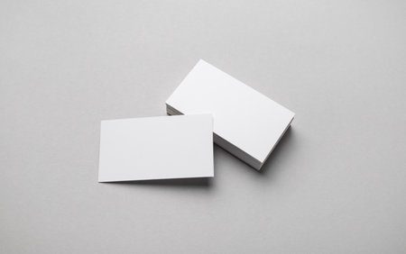 Photo of blank business cards on gray paper background. Template for ID.の写真素材