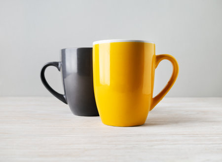 Two blank tea cups or coffee mugs. Responsive design mockup. selective focus.の写真素材