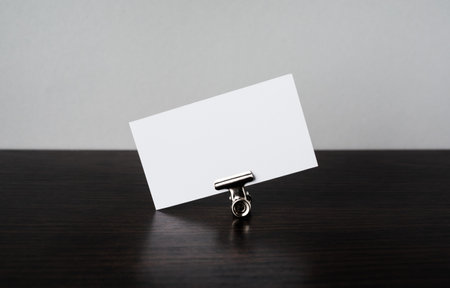 Blank white business card and paper clip. Template for graphic designers portfolios.の写真素材
