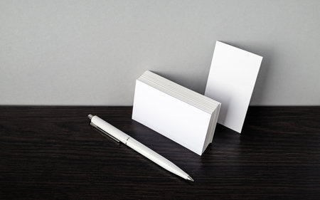 Blank business cards and white pen. Template for branding ID.の写真素材