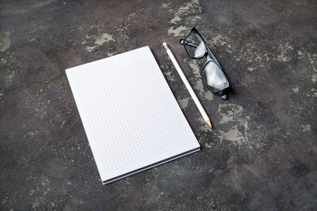 Branding stationery mockup. Copybook, glasses and pencil. Blank objects for placing your design.の写真素材