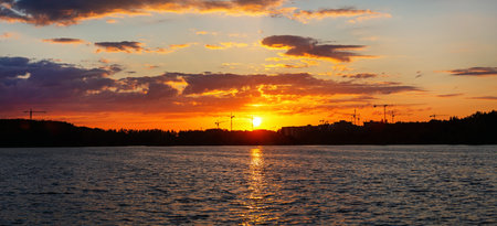 Golden summer sunset over the lake. Panoramic view.の写真素材