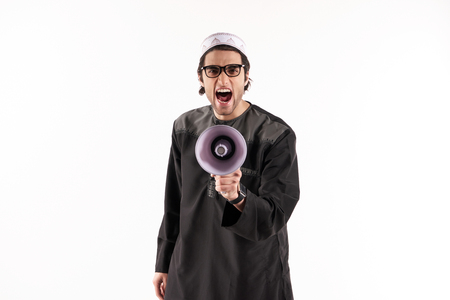 Arab man speaks in megaphone. Announcements concept. Isolated on white background.の写真素材