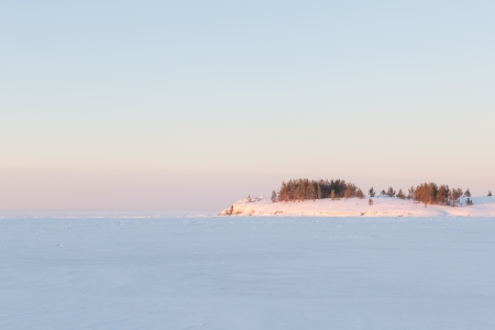 Winter, stony coast of the frozen lake.  winter landscape