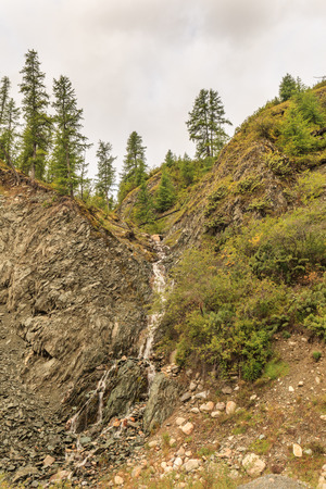 Falls at a mountain foot. A summer landscape.の写真素材
