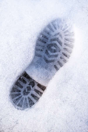 trail of shoes in the snow, tread in the snow.