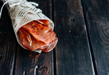 Dried chicken in bags on a wooden board close-upの写真素材