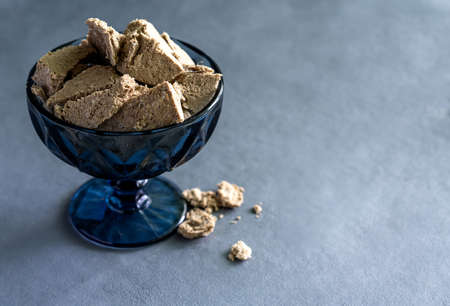 Sunflower halva in a vase on a gray background. Made from sunflower seeds.の写真素材