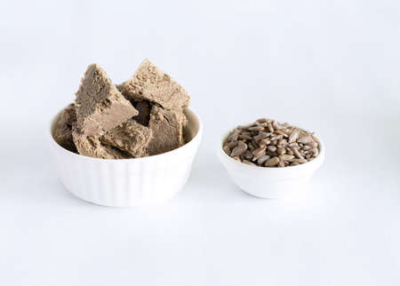 halva from sunflower seeds on a white plate. national traditional sweetness of turkish halva on the table. High quality photoの写真素材