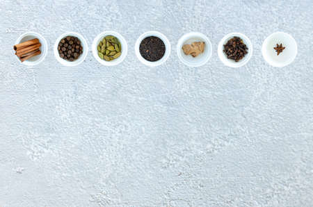 Ingredients for Indian masala tea on gray backgroundの写真素材