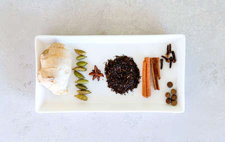 Ingredients for Indian masala tea on gray backgroundの写真素材