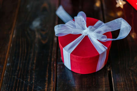 Christmas gift boxes under the tree, on the wooden floor.の写真素材