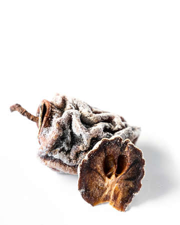 Dried, dried persimmon on a white background.. High quality photo