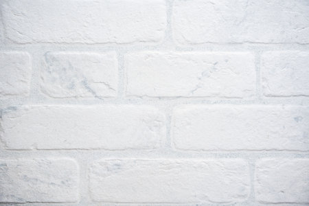 The modern texture of a white brick wall can be used as a background or a sample for a design. high...