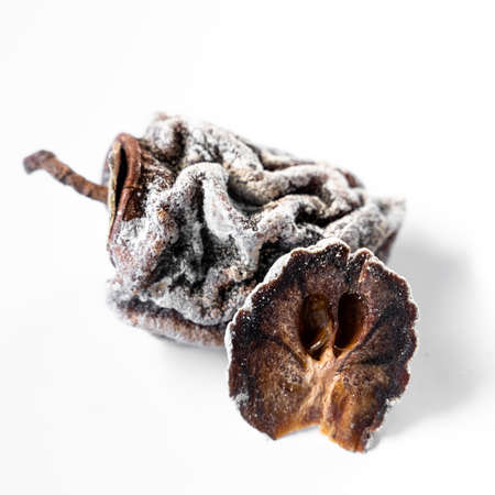 Dried persimmon on a white background. healthy diet. high quality photoの写真素材