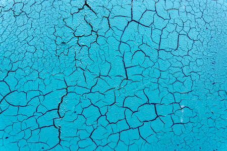 Cracked and damaged painted surface of a building or wall. Texture, aged paint background. high quality photoの写真素材