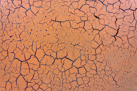 Cracked and damaged painted surface of a building or wall. Texture, aged paint background. high quality photoの写真素材
