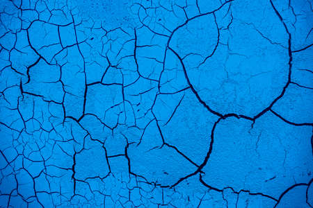 Cracked and damaged painted surface of a building or wall. Texture, aged paint background. high quality photoの写真素材