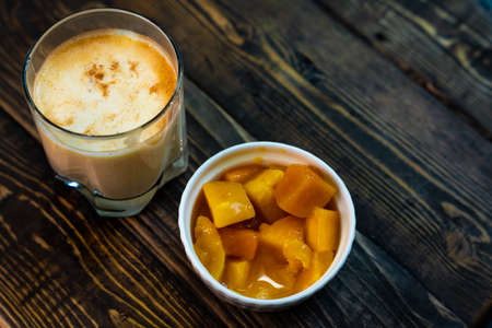 Yellow Indian mango yoghurt drink Mango Lassi or smoothie with turmeric and saffron. Healthy probiotic Indian cold summer drink.. High quality photoの写真素材