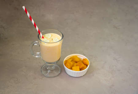 Yellow Indian mango yoghurt drink Mango Lassi or smoothie with turmeric and saffron. Healthy probiotic Indian cold summer drink.. High quality photoの写真素材