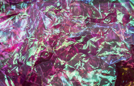 colorful grunge background. Rough texture. Neon light red green blue shiny wrinkled rock dark abstract art. high quality photoの写真素材