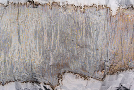 Crumpled and shiny silver paper background. high quality photoの写真素材
