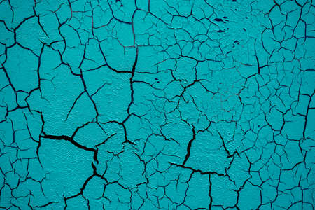 Cracked and damaged painted surface of a building or wall. Texture, aged paint background. high quality photoの写真素材