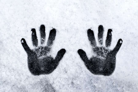 Hand prints on wall, black and white. high quality photoの写真素材