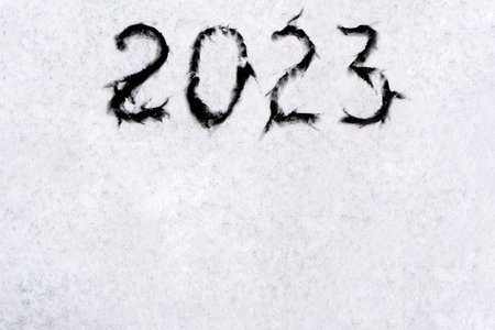 numbers 2023 paint handwritten on flour brown table. high quality photoの写真素材