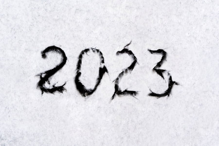 numbers 2023 paint handwritten on flour brown table. high quality photoの写真素材