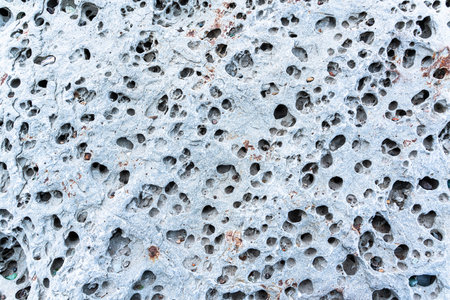 texture of porous stones on the beach, nature, natural phenomena, brown gray stones. high quality photoの写真素材