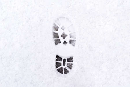 trail of shoes in the snow, tread in the snow. high quality photoの写真素材