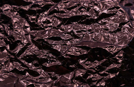 Abstract texture pattern metallic paper using as a background or wallpaper. Metal aluminum foil shiny and reflector. high quality photoの写真素材