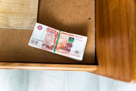large stash of money for a rainy day, hidden at home. high quality photoの写真素材