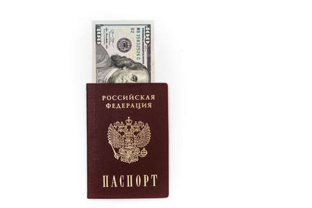 American dollars, 100 dollar bills lie in the passport of the Russian Federation, close-up on a white background. high quality photoの写真素材