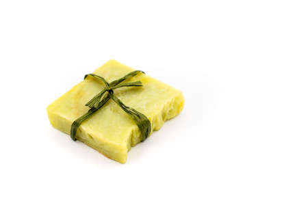 Natural handmade soap bars on wooden background. Spa organic soap in eco paper packaging. high quality photoの写真素材