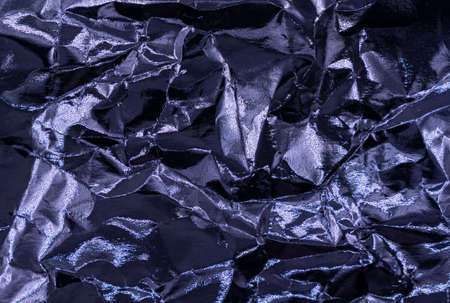Crumpled very peri or violet foil background. abstract pattern. Trendy color of the Year 2022. High quality photoの写真素材