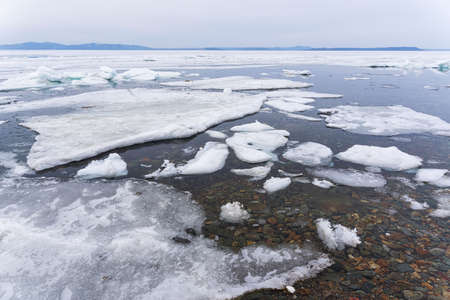 Melting ice. Icebreaker, many white ice floats in the water. high quality photoの写真素材
