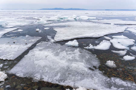 Melting ice. Icebreaker, many white ice floats in the water. high quality photoの写真素材