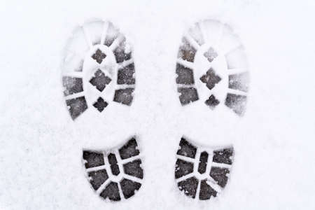 trail of shoes in the snow, tread in the snow. high quality photoの写真素材