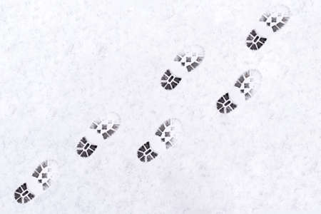 trail of shoes in the snow, tread in the snow. high quality photoの写真素材